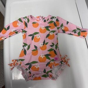 Ruffle Butts Orange Print Long Sleeve Swimsuit